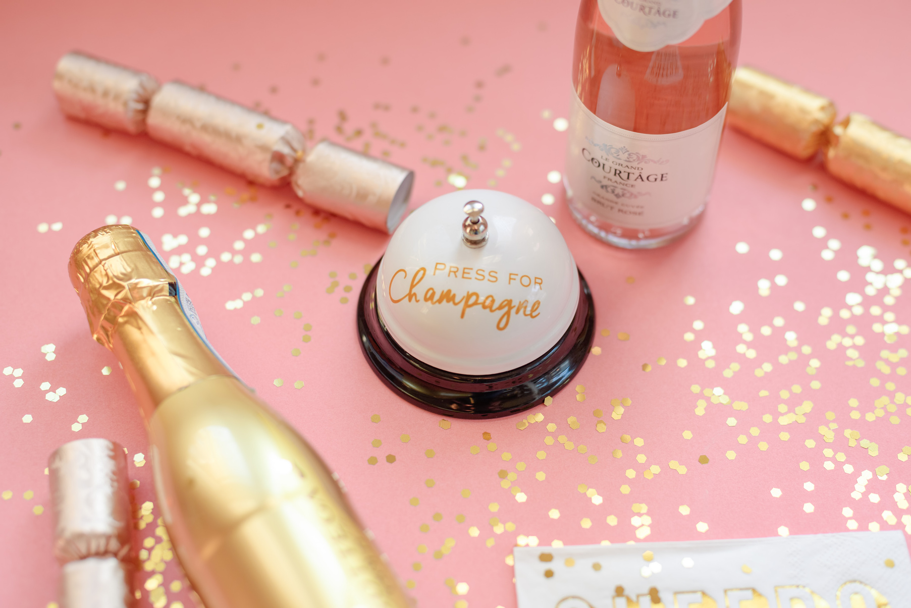 Pink and gold champagne party flat lay
